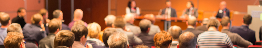 group of people enjoying a conference presentation