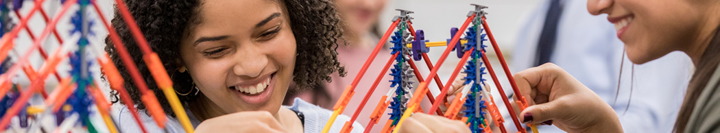 Young girl building complex structure